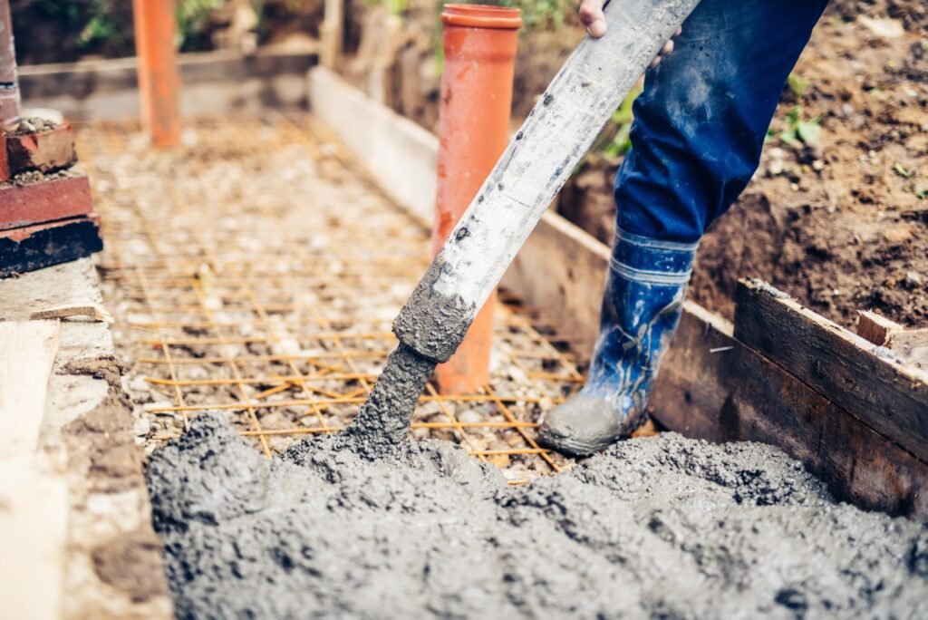 construction site details - building sidewalks and pouring cement on reinforcement bars